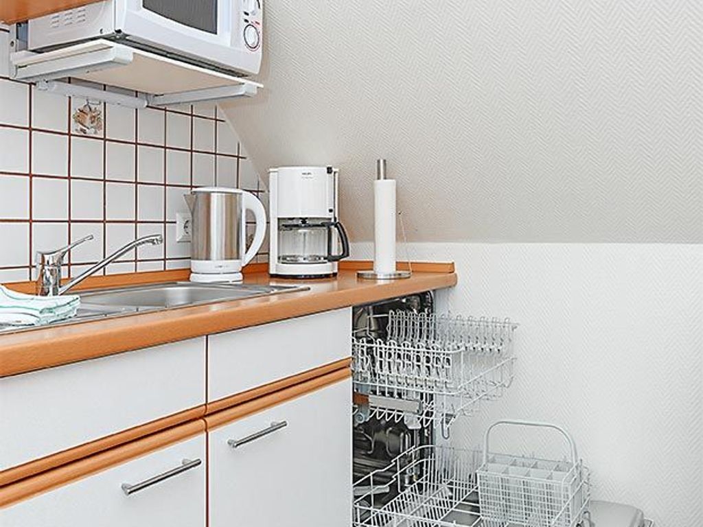 Wohnzimmer mit integriertem Küchenbereich