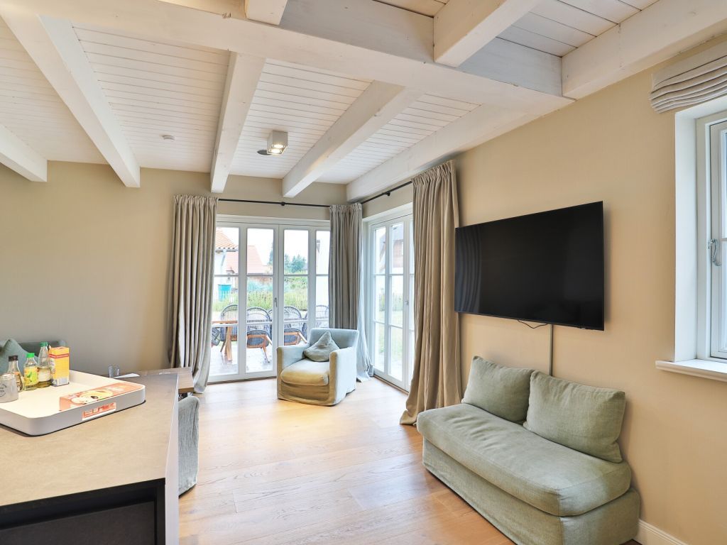 Strandheimat - Blick auf den Wohnbereich und den TV