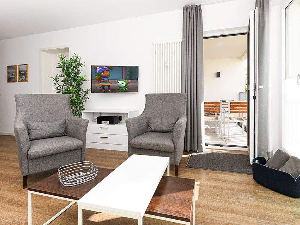 Wohnzimmer mit integriertem Küchenbereich