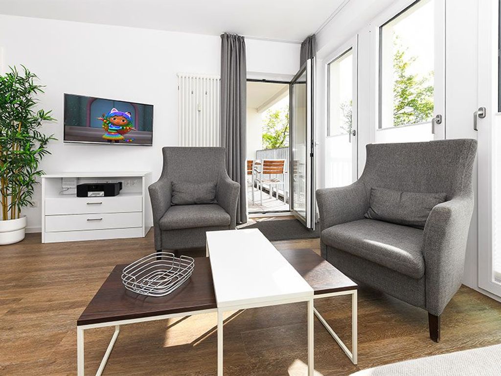 Wohnzimmer mit integriertem Küchenbereich