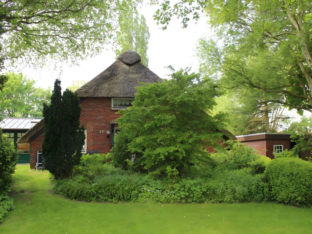 Reetdachhaus am Deich - Ferienwohnung Wintergarten