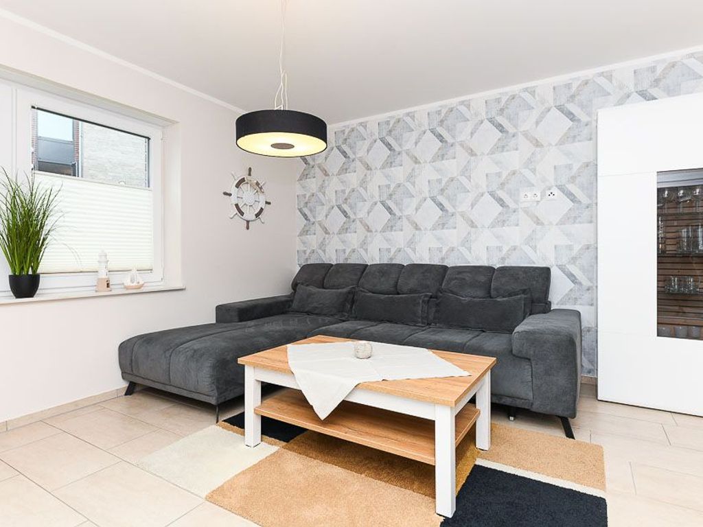 Wohnzimmer mit integriertem Küchenbereich