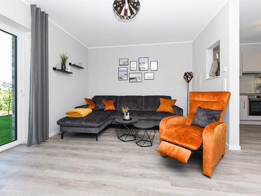 Wohnzimmer mit integriertem Küchenbereich