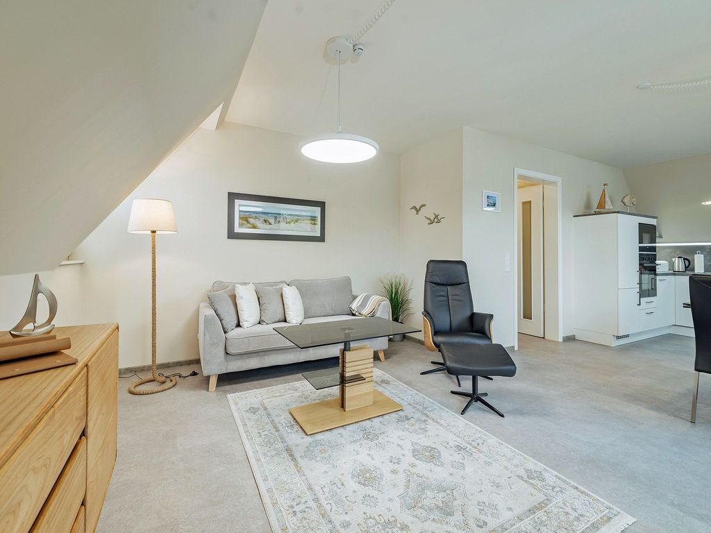 Integral Immobilien: Dein Darß Urlaub Born - moderner Wohnbereich der Ferienwohnung Schietbüdel