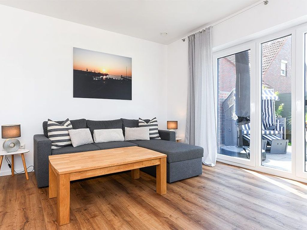 Wohnzimmer mit Essplatz und integrierter Küche