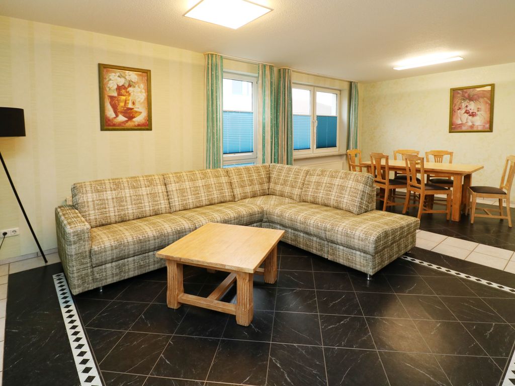 Wohnzimmer mit Essbereich  Ferienwohnung Q01 Karlshagen