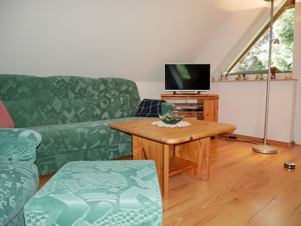 Wohnzimmer mit offener Küche
