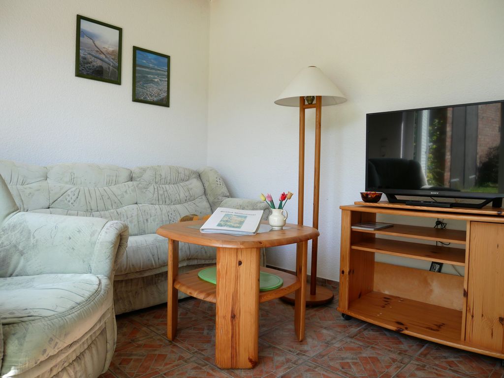 Wohnzimmer mit offener Küche