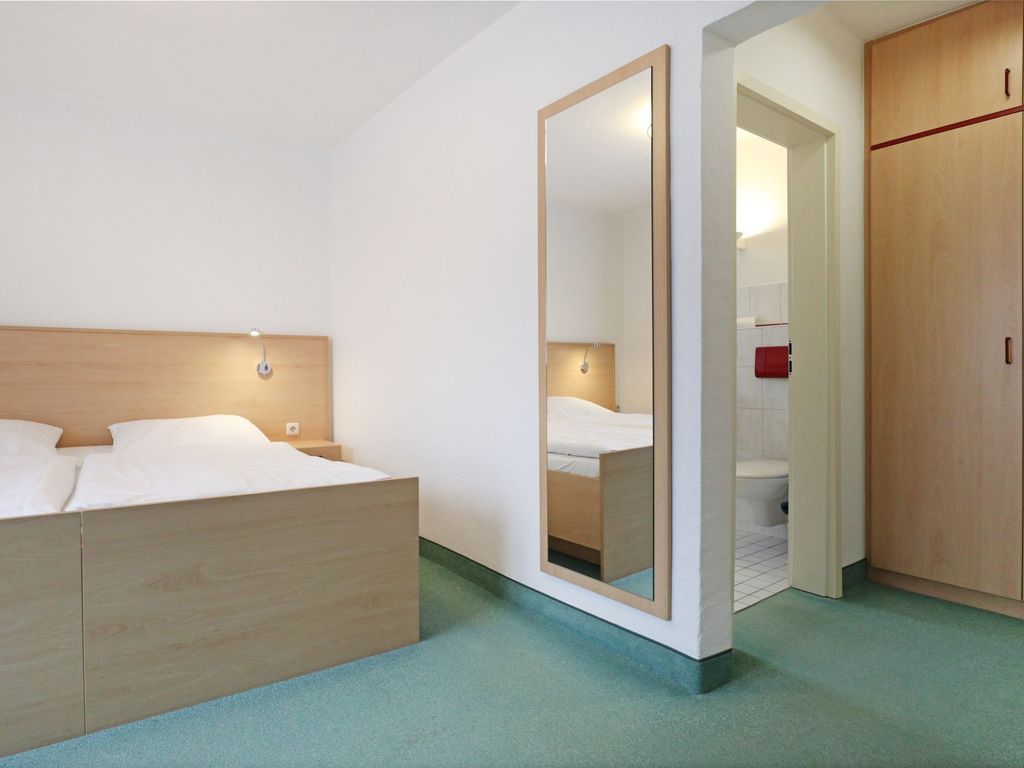 Strandflieder Zimmer 307 - Blick auf den offenen Wohn-/ Schlafbereich