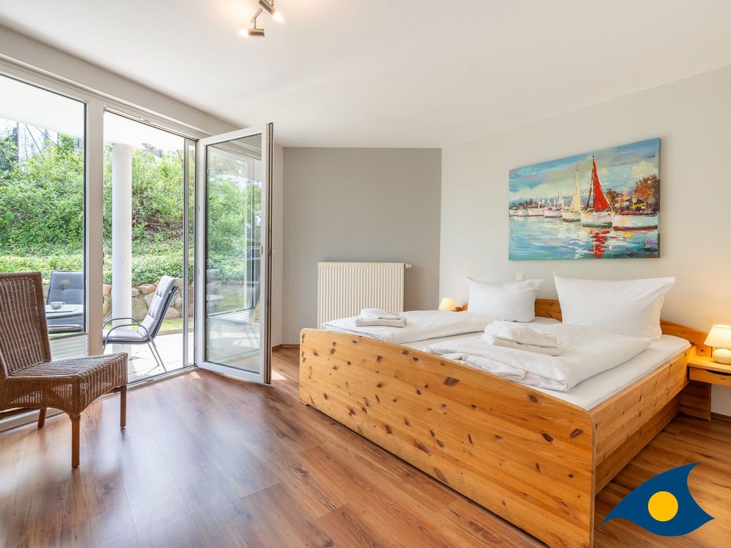 Schlafzimmer mit Zugang zur Terrasse