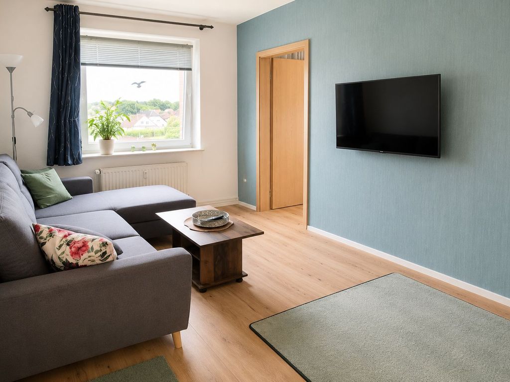 Wohnzimmer mit Sitzcouch und TV (KI optimiert)