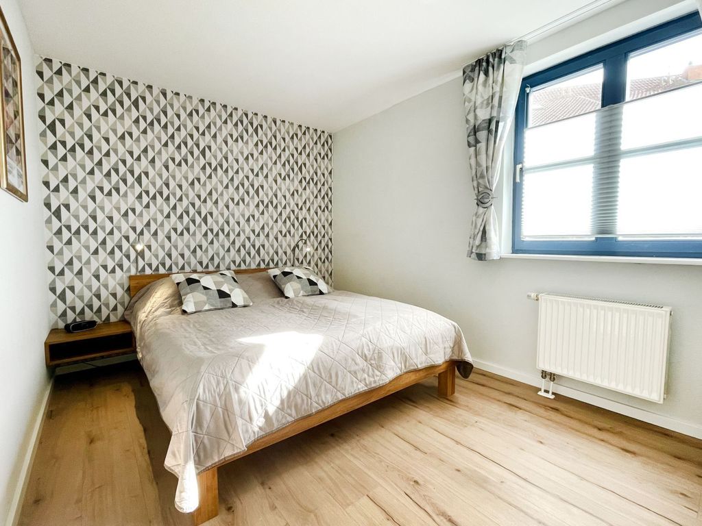 Papillon 7/1 - Blick in das Schlafzimmer mit einem Doppelbett