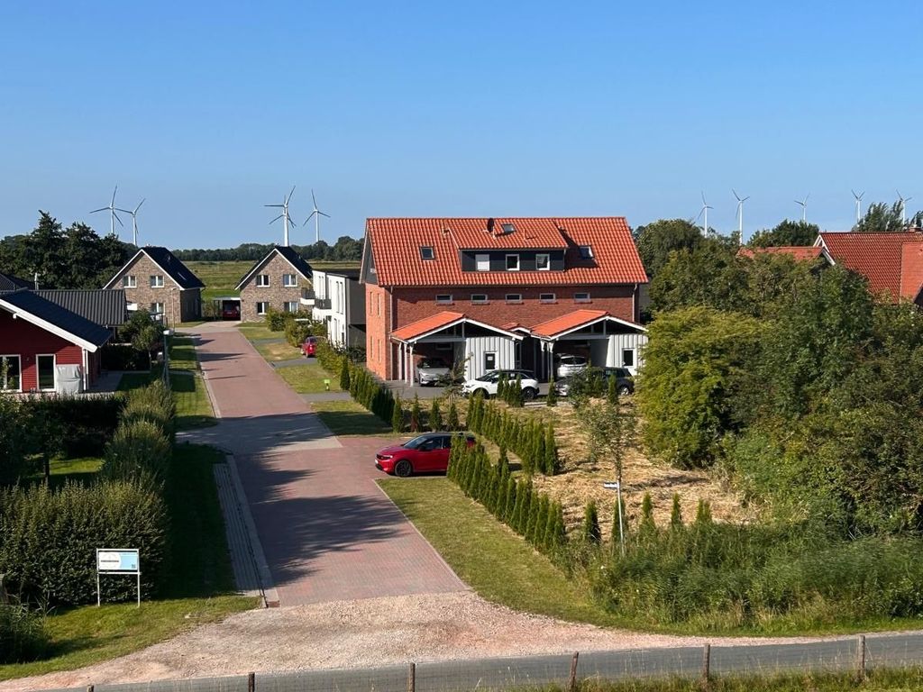 Blick vom Deich auf die Ferienwohnung Deichzauber