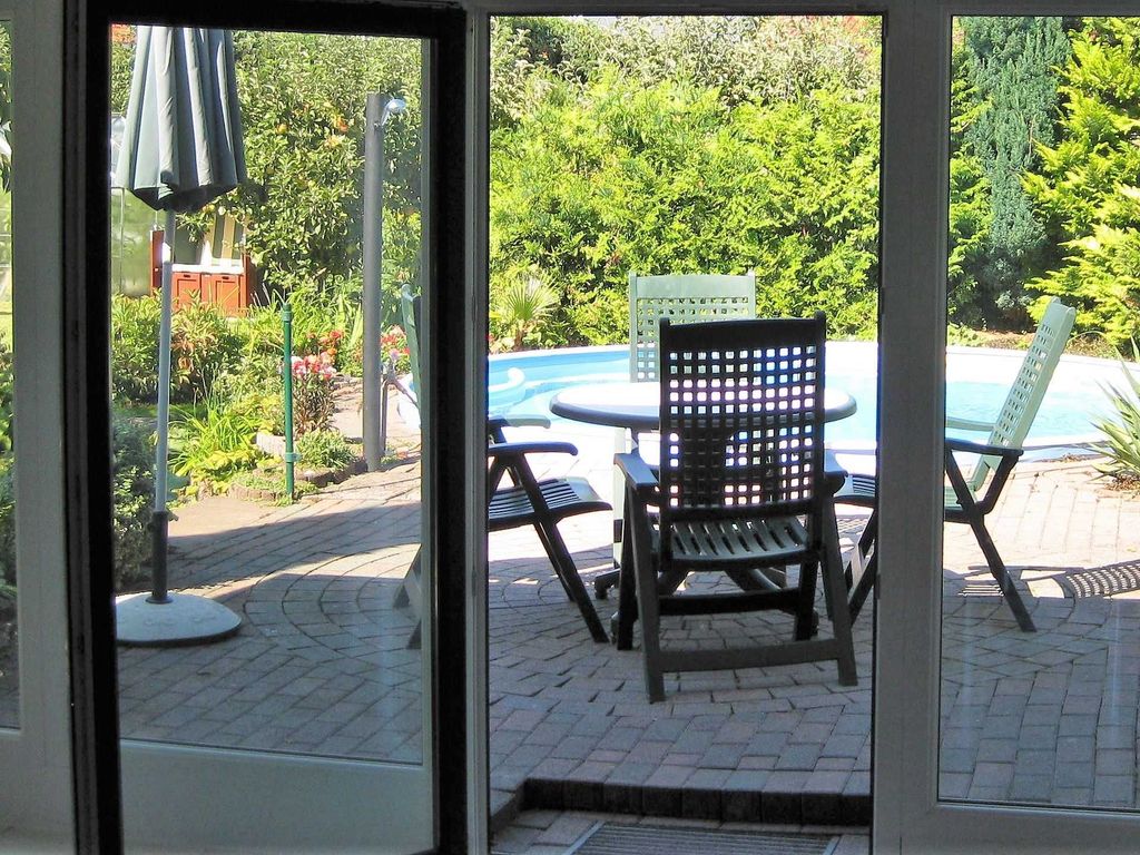 Ferienwohnung mit Garten und Poolblick