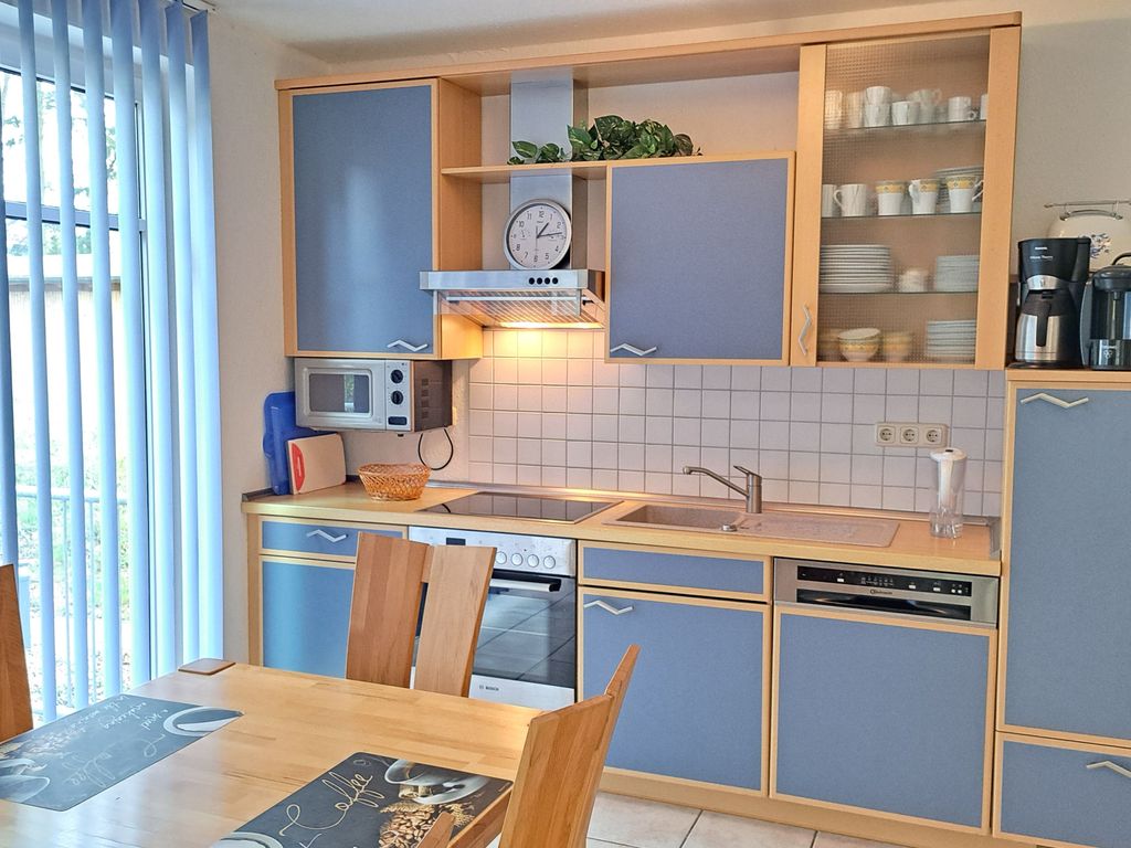 Wohnzimmer mit offener Küche