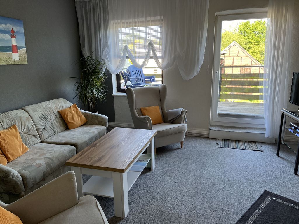Wohnzimmer mit Balkon