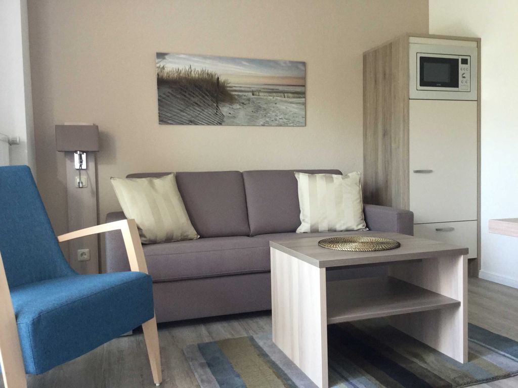 Wohnzimmer mit offener Küche