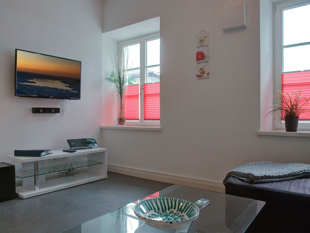 Ferienwohnung von Thiersch - Wohnbereich mit Flachbildfernseher