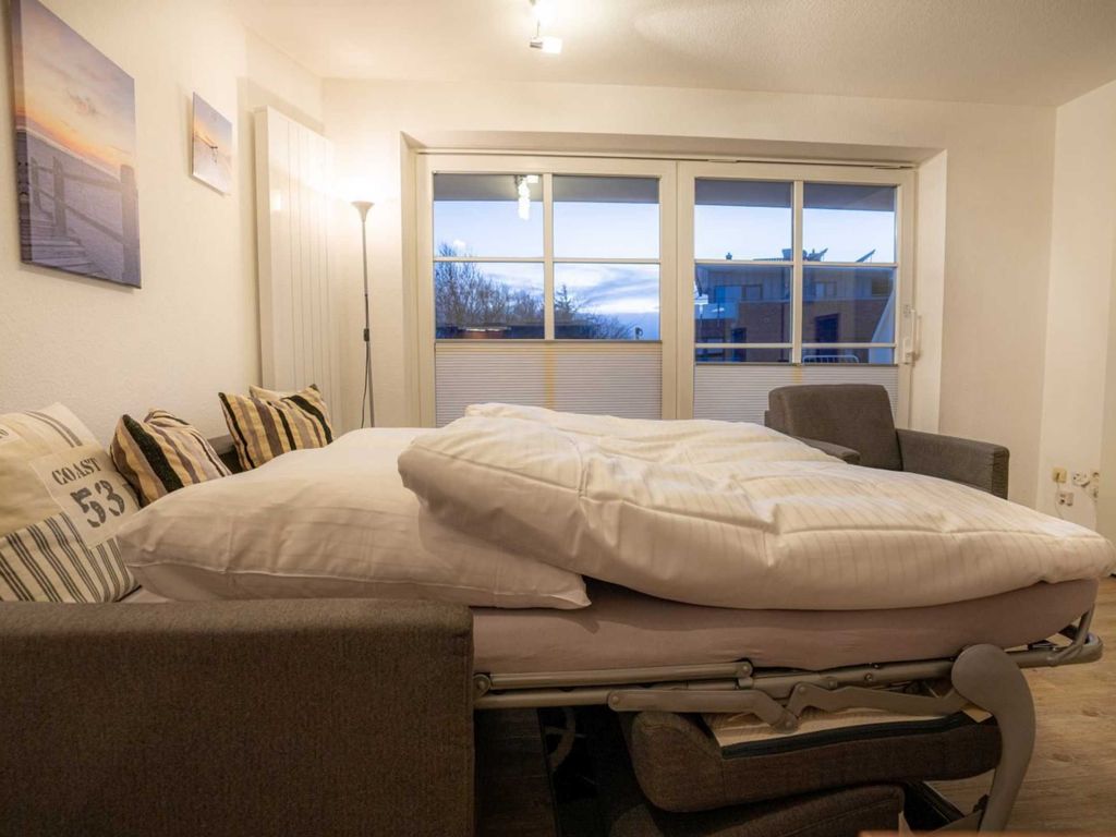 Wohnzimmer mit Schlafsofa