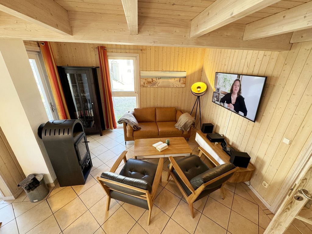 Ferienhaus Sprottenkiste - Wohnzimmer mit Kamin